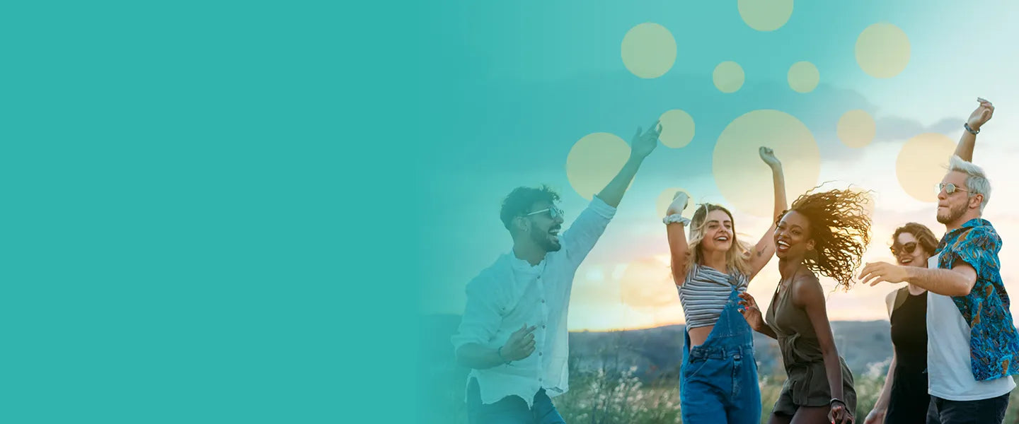 a group of young adults in a field having fun