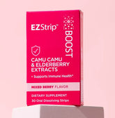 EZStrip Boost dietary supplement box featuring Camu Camu and Elderberry extracts, placed on a white stand against a pastel pink background