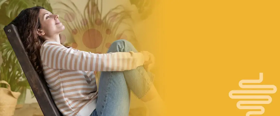 A woman lounging in a chair, smiling in a relaxed posture with a digestive system icon, symbolizing gut health and stress relief.
